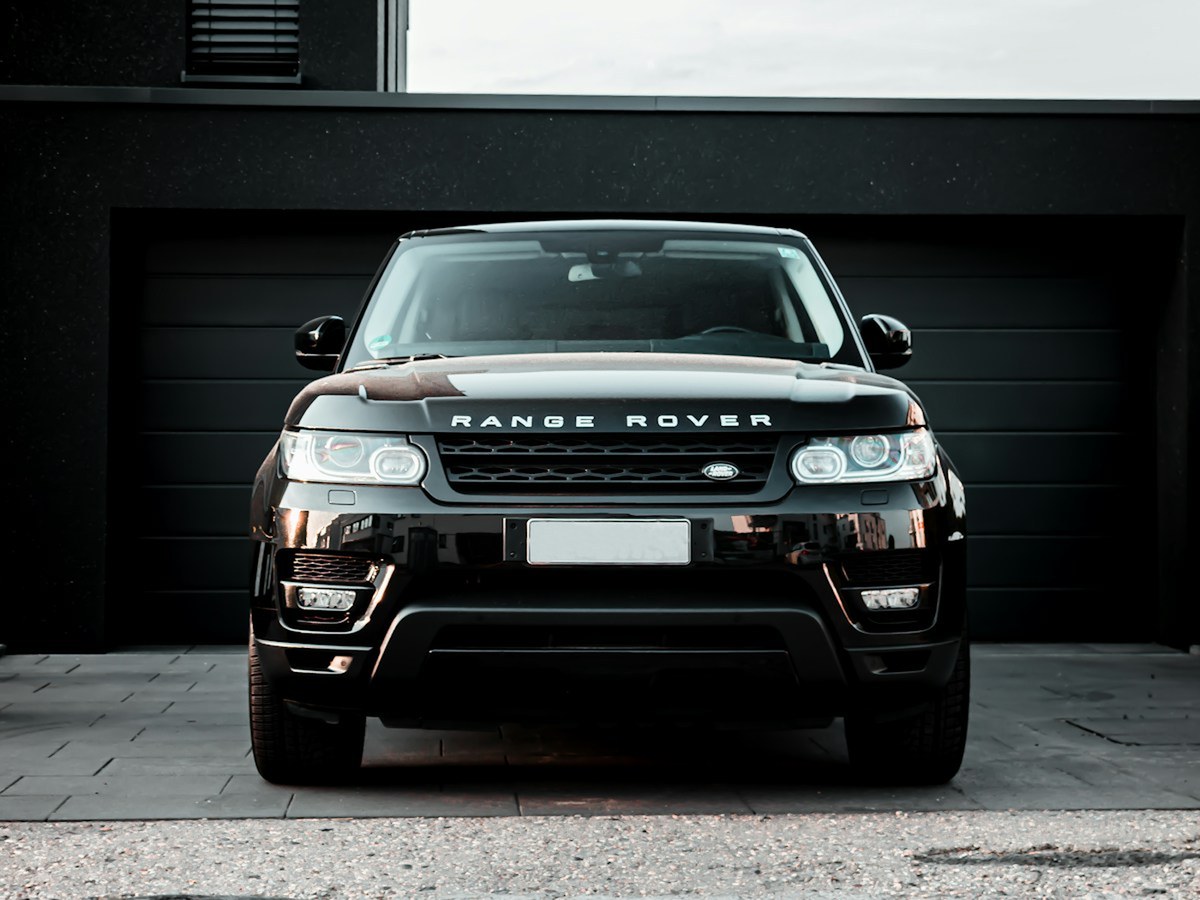 Glossy black luxury SUV after professional detailing
