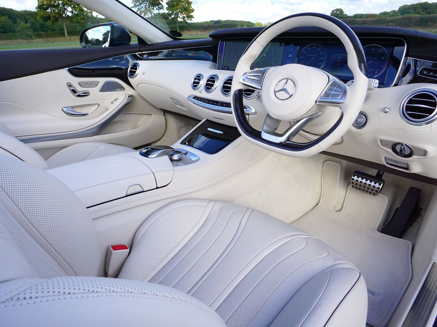 Deep-cleaned cream leather luxury car interior